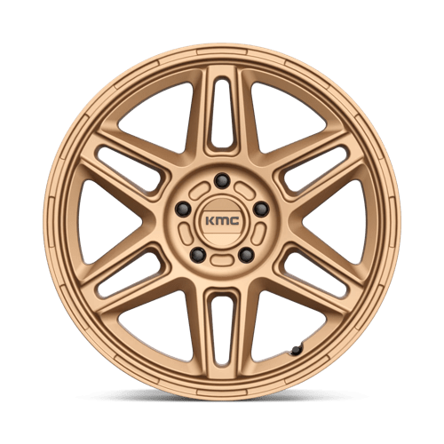 KMC KM716 NOMAD Matte Bronze wheel showcasing rugged design and aggressive style for off-road adventures.