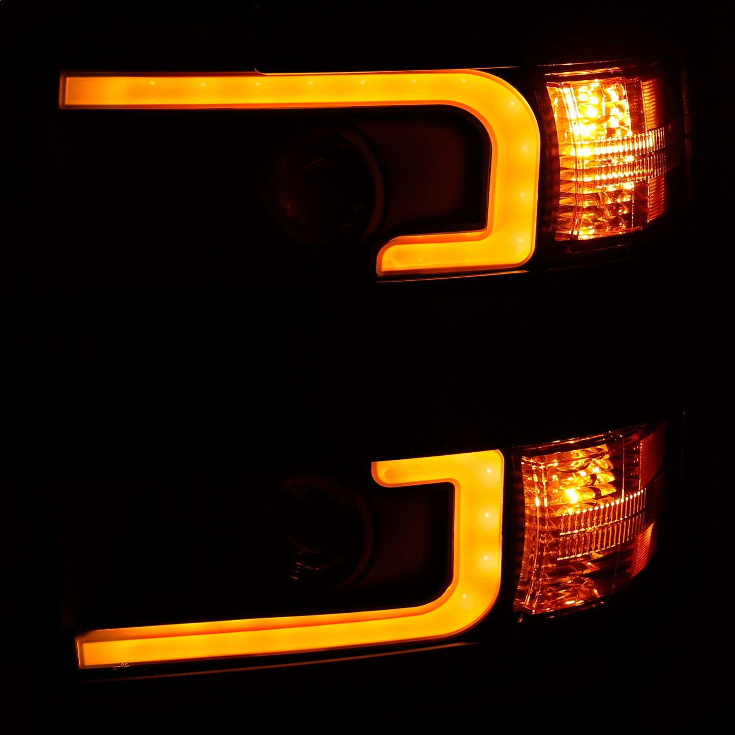 Anzo USA | Projector Headlight Set Clear Lens w/Plank Style Switchback Black w/Amber Black Rim Pair | Fits Silverado 2500 HD | 111364