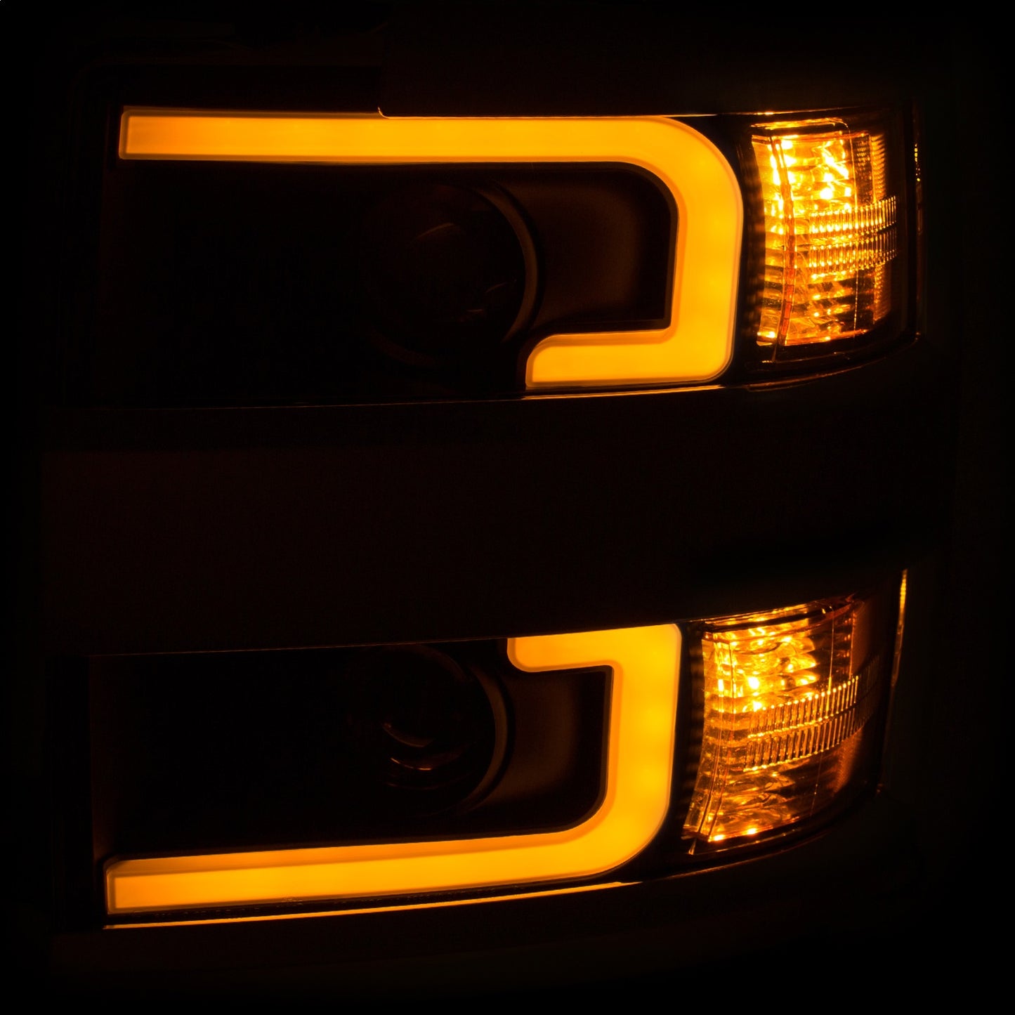 Anzo USA | Projector Headlight Set Clear Lens w/Plank Style Switchback Black w/Amber Chrome Rim Pair | Fits Silverado 2500 HD | 111365
