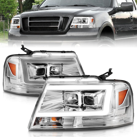 Anzo USA | Projector Headlight Set Clear Lens Chrome Housing w/Light Bar Pair | Fits F-150 | 111542