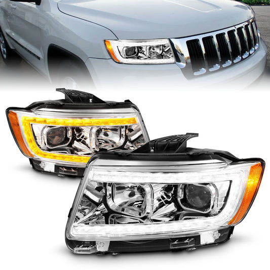 Anzo USA | Projector Headlight Set Clear Lens Chrome Housing w/Light Bar Switchback Pair | Fits Grand Cherokee | 111569