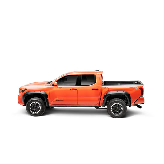 Husky Liners | Pocket Style Fender Flare 4 PC Set For 2024-2026 Tacoma Husky Liners | 2803930 installed on orange Tacoma truck.