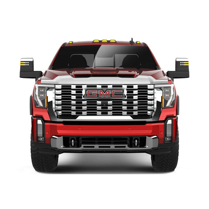 GMC truck front view showcasing shiny chrome grill and sleek design features.