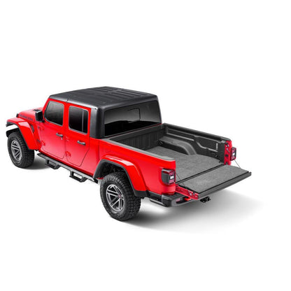 BedRug 2020-2025 Jeep JT Gladiator 5' Bed 3/4 Inch Thick Bed Mat - Charcoal (BMJ20SBS) installed in a red Jeep Gladiator.