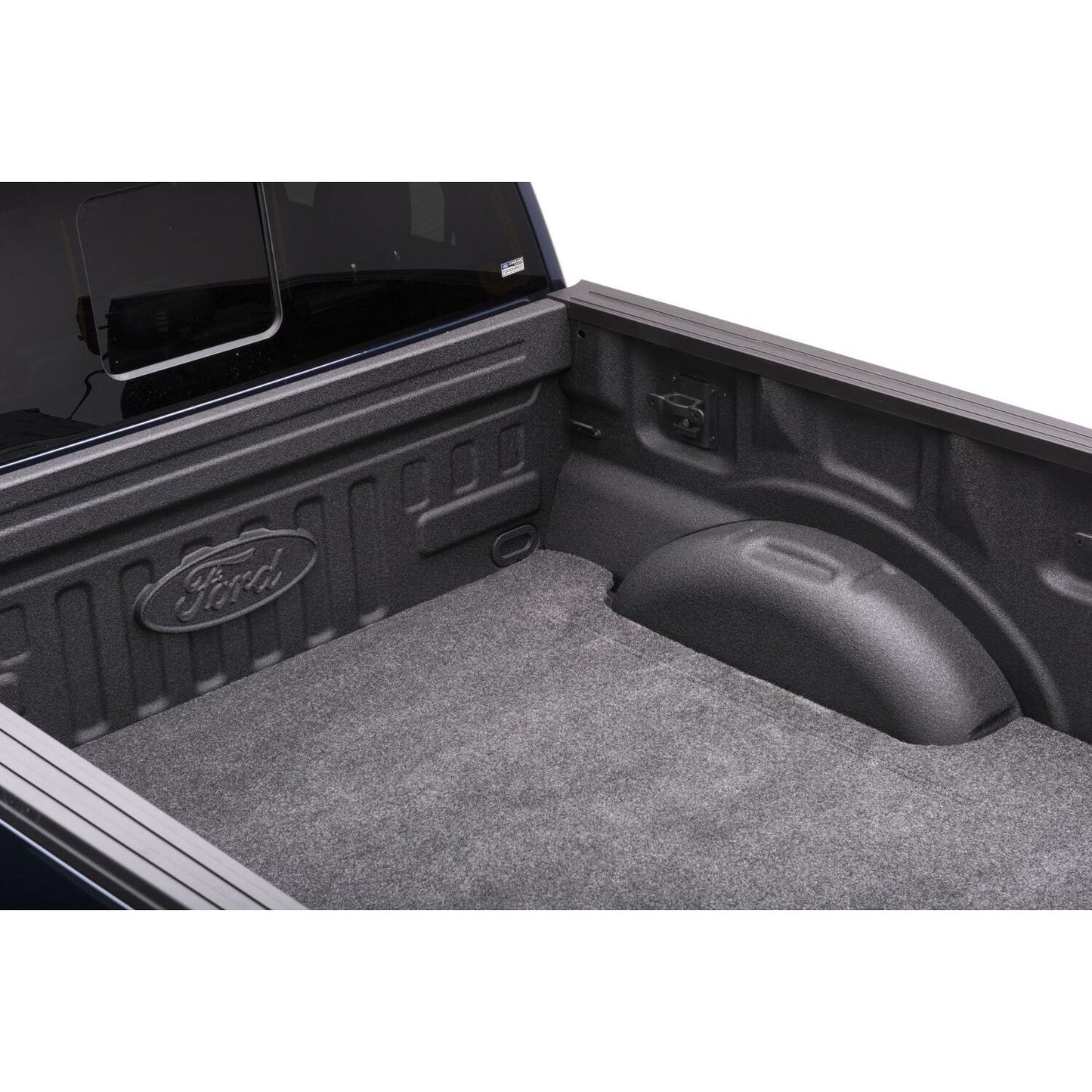 Interior view of a Ford truck bed showcasing the spray-in liner compatible with BedRug Bedmat For Spray-In Or No 99-16 Ford Super Duty 6'6" Bed 3/4 Inch Thick Bed Mat - Charcoal (BMQ99SBS)