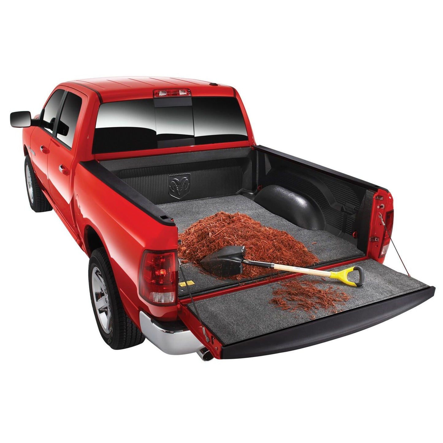 BedRug 07-21 Toyota Tundra 5'6" Bed Mat - Charcoal (BMY07SBD) installed in a red pickup truck bed with mulch.