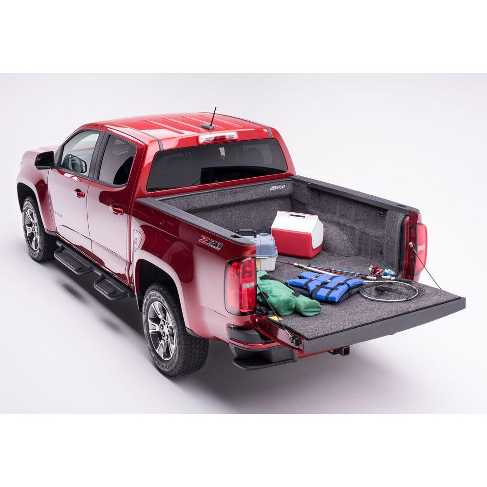 BedRug 23-25 Colorado/Canyon Crew Cab 5' Bed Liner w/ Tailgate Mat - Charcoal (BRB23CCK) installed in a red truck bed.