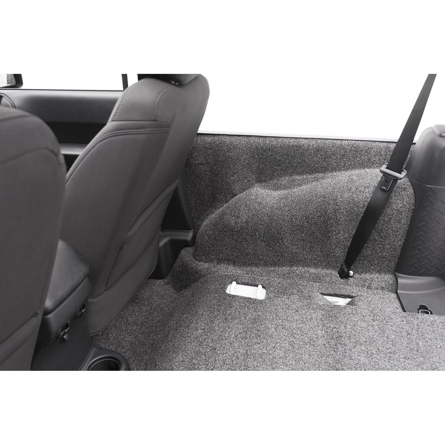 BedRug Jeep 07-10 Jeep JK 2Dr Rear 5Pc Cargo Kit - Charcoal installed in rear seating area.
