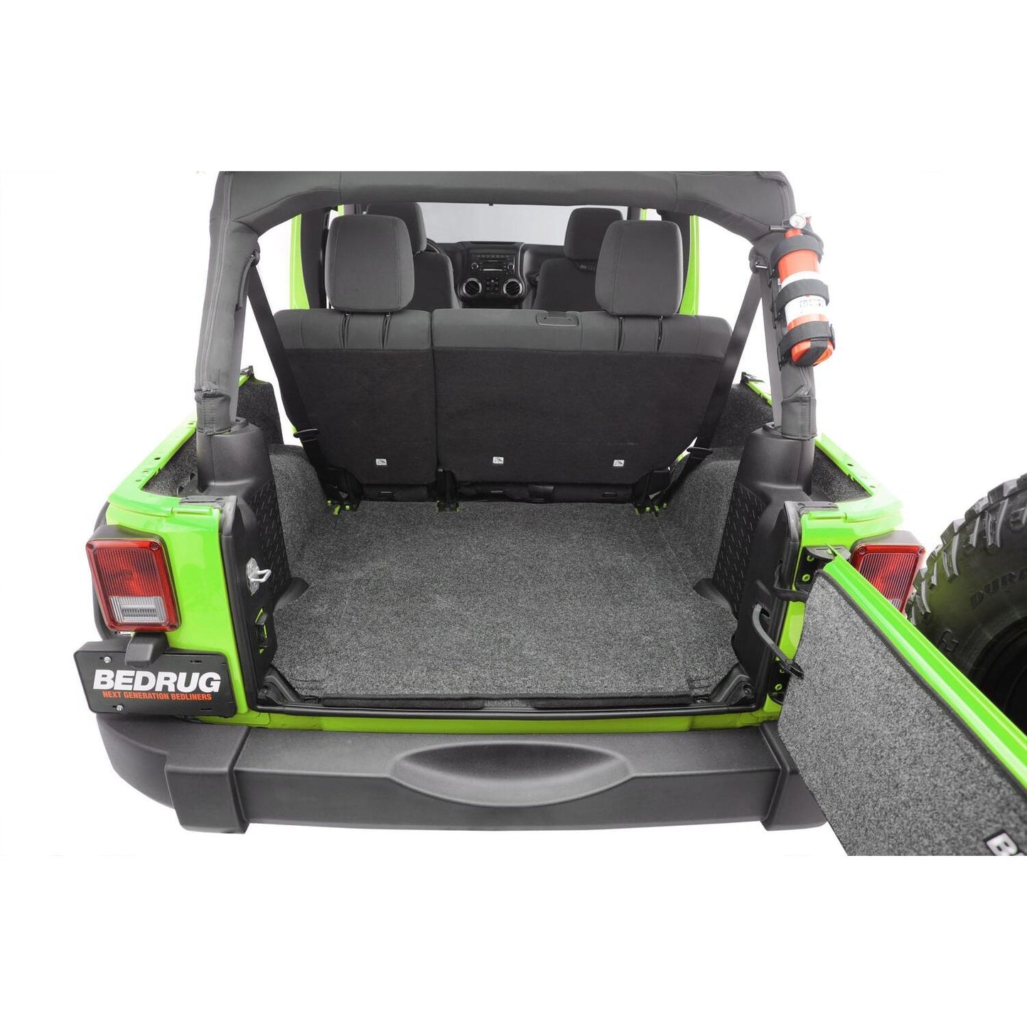 BedRug Jeep 07-10 JK Unltd 4Dr RR 5Pc Cargo Kit - Charcoal (Inc Tlgte & Tub Liner) installed in a Jeep trunk.