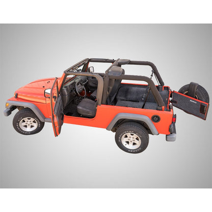BedRug Jeep 03-06 Jeep LJ Unltd Rear 4Pc Cargo Kit - Charcoal installed in orange Jeep Wrangler with rear cargo area visible.