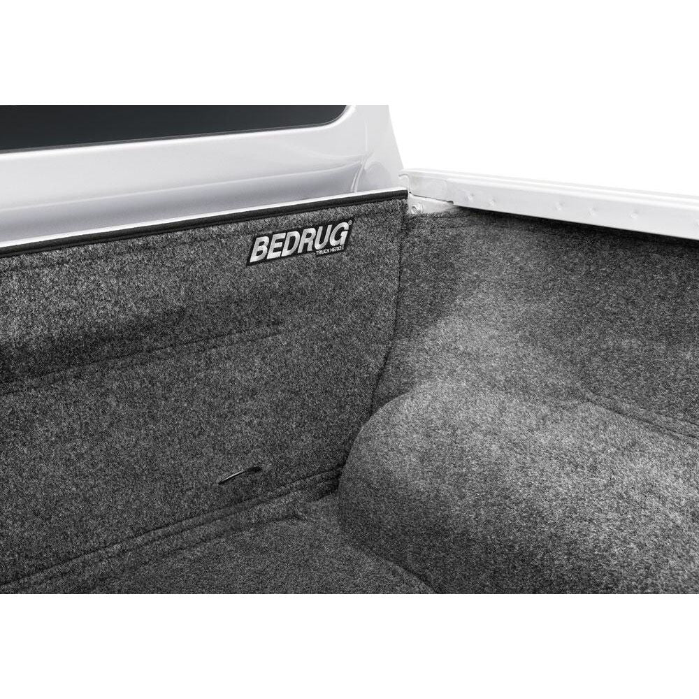 BedRug 04+ Nissan Titan Crew Cab 5.5' Bed Liner w/ Tailgate Mat - Charcoal (BRN04CCK) showcased in a truck bed.