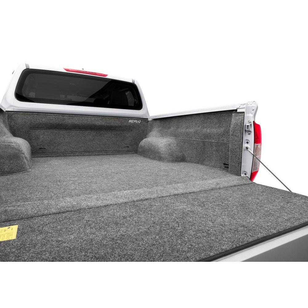 BedRug 04+ Nissan Titan Crew Cab 5.5' Bed Liner w/ Tailgate Mat - Charcoal (BRN04CCK) installed in truck bed.