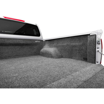BedRug 04+ Nissan Titan Crew Cab 5.5' Bed Liner w/ Tailgate Mat - Charcoal (BRN04CCK) installed in truck bed.