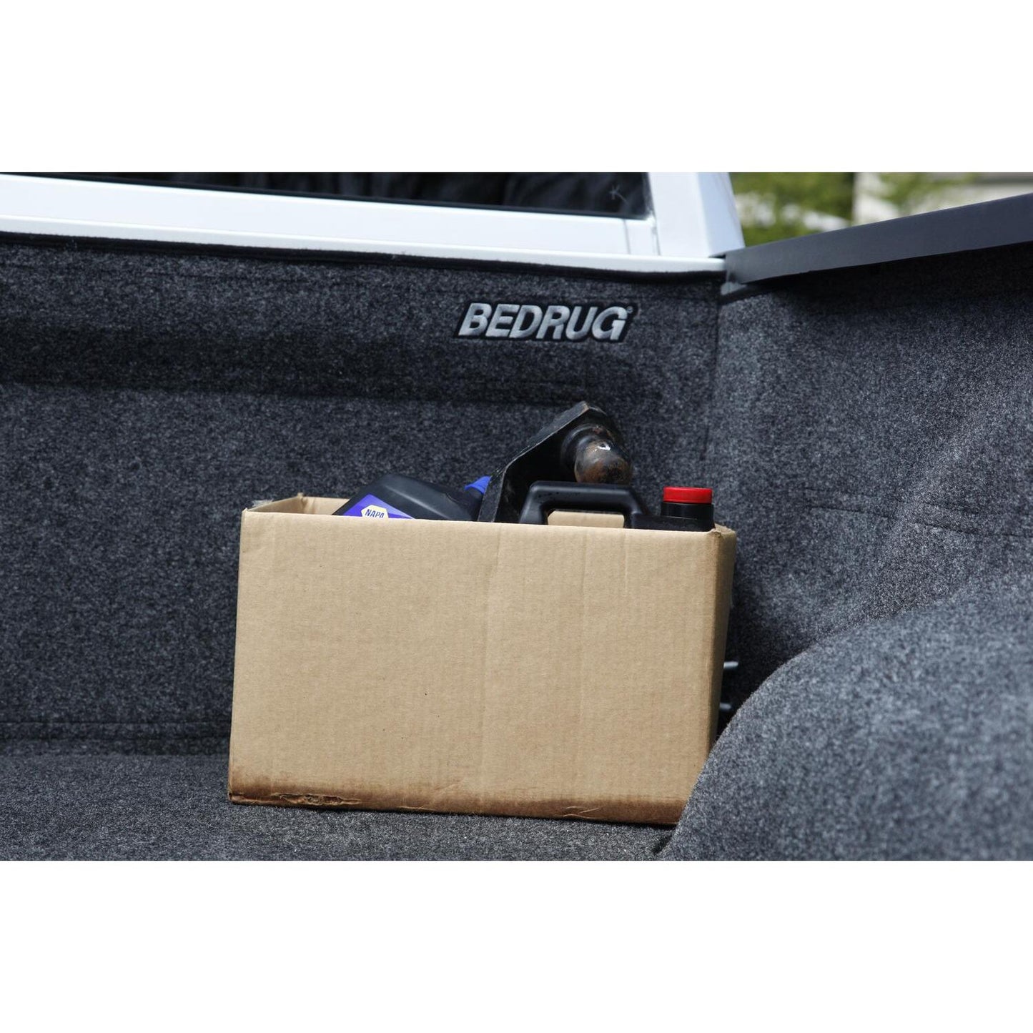 BedRug 2019-2025 Ram 1500 5'7" Bed Liner w/ Tailgate Mat w/o RamBox w/o Multifunction Tailgate - Charcoal (BRT19CCK) with storage box.