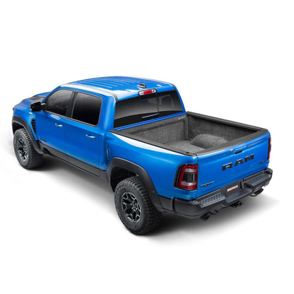 BedRug 2019-2025 Ram 1500 5'7" Bed Liner w/ Tailgate Mat w/o RamBox w/o Multifunction Tailgate - Charcoal (BRT19CCK) on blue truck.