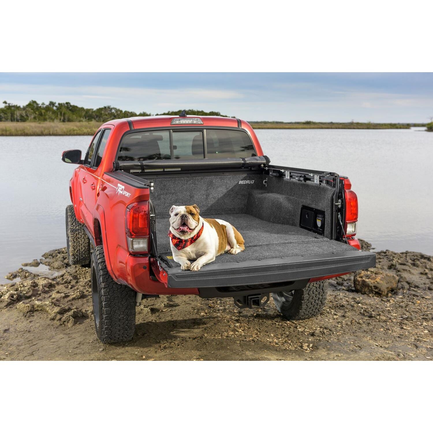 BedRug 05+ Toyota Tacoma 5' Bed Liner w/ Tailgate Mat - Charcoal (BRY19DCK) installed in a truck bed with a dog.