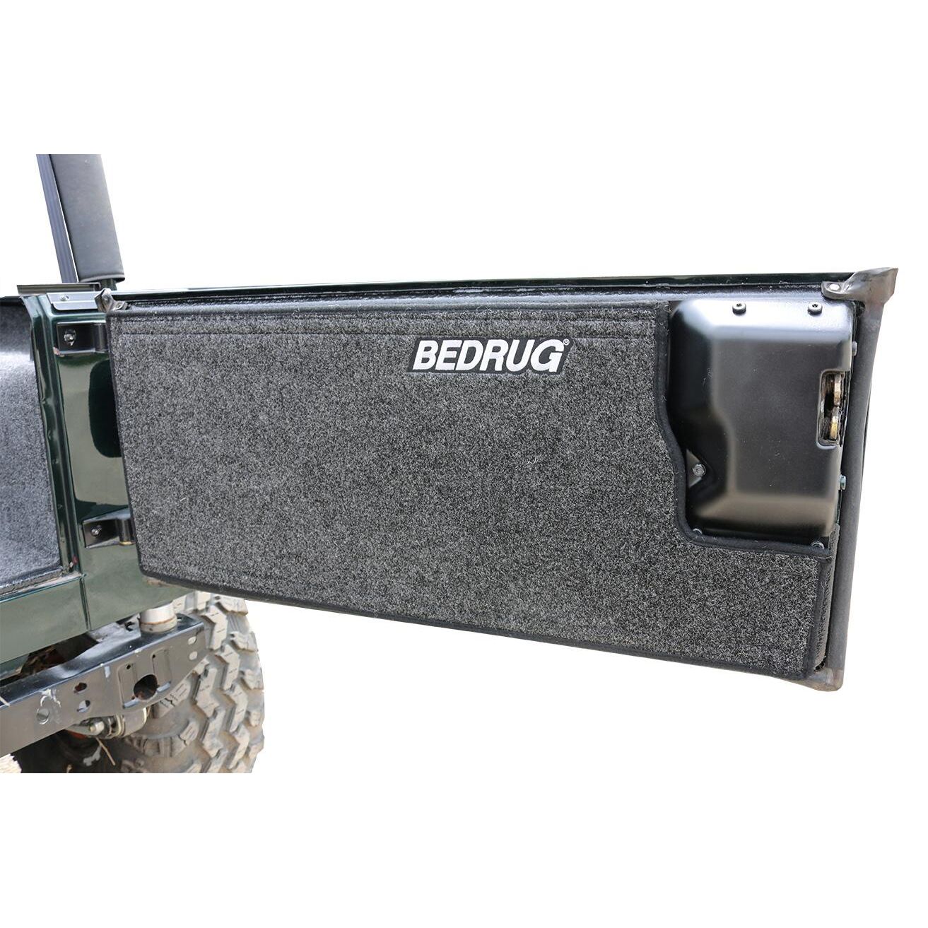 BedRug Jeep 87-95 Jeep YJ Rear Kit 4 PC Cargo Kit - Charcoal (Inc Tlgte & Cargo Liner) mounted on tailgate.