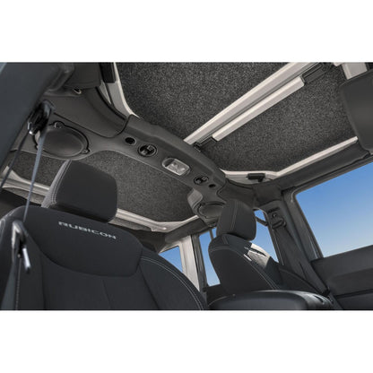 Interior view of BedRug 2018-2026 Jeep Wrangler 4 Door Bed Liner - Charcoal (HLJL184DRK) installation inside a Jeep.