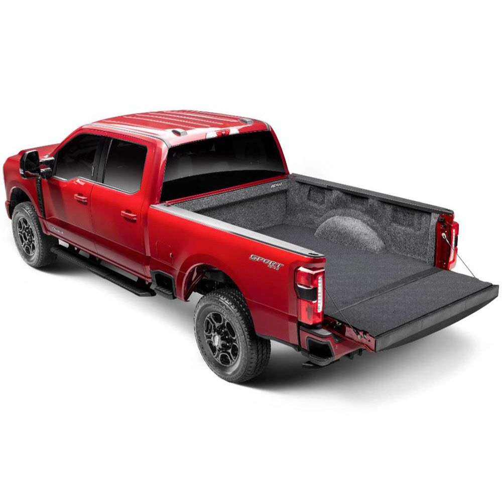 BedRug 2017-2026 Ford F-250/F-350 Super Duty 8' Bed Impact Bed Liner w/ Tailgate Mat - Charcoal (ILQ17LBK) installed in red truck bed.