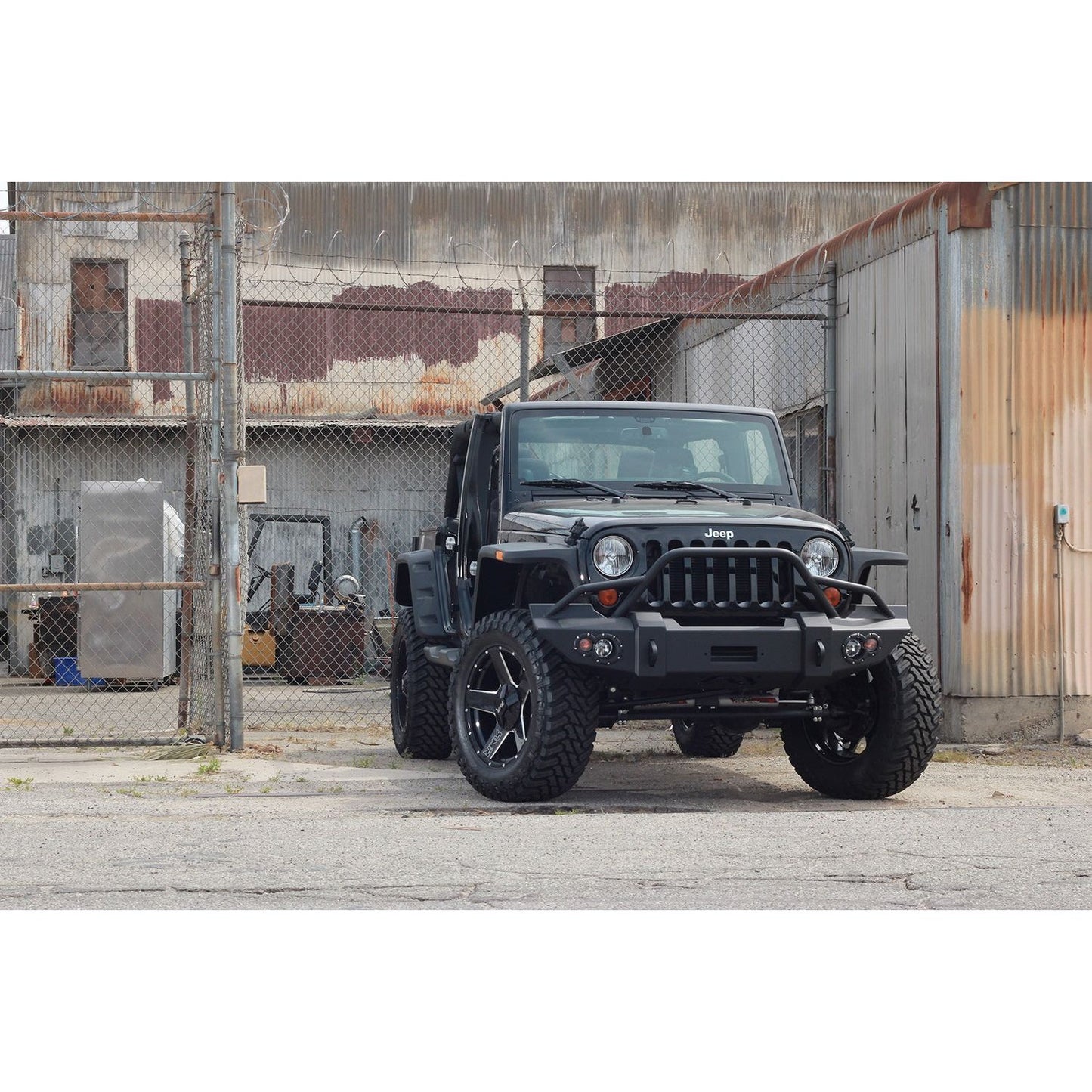 Fab Fours Lifestyle Winch Front Bumper 2 Stage Black Powder Coated w/Pre-Runner Grill Guard Incl. Winch Mount/1 in. D-Ring Mounts/Light Cut-Outs w/Hella 90mm Fog Lamps/60mm Turn Signals l JK07-B1850-1