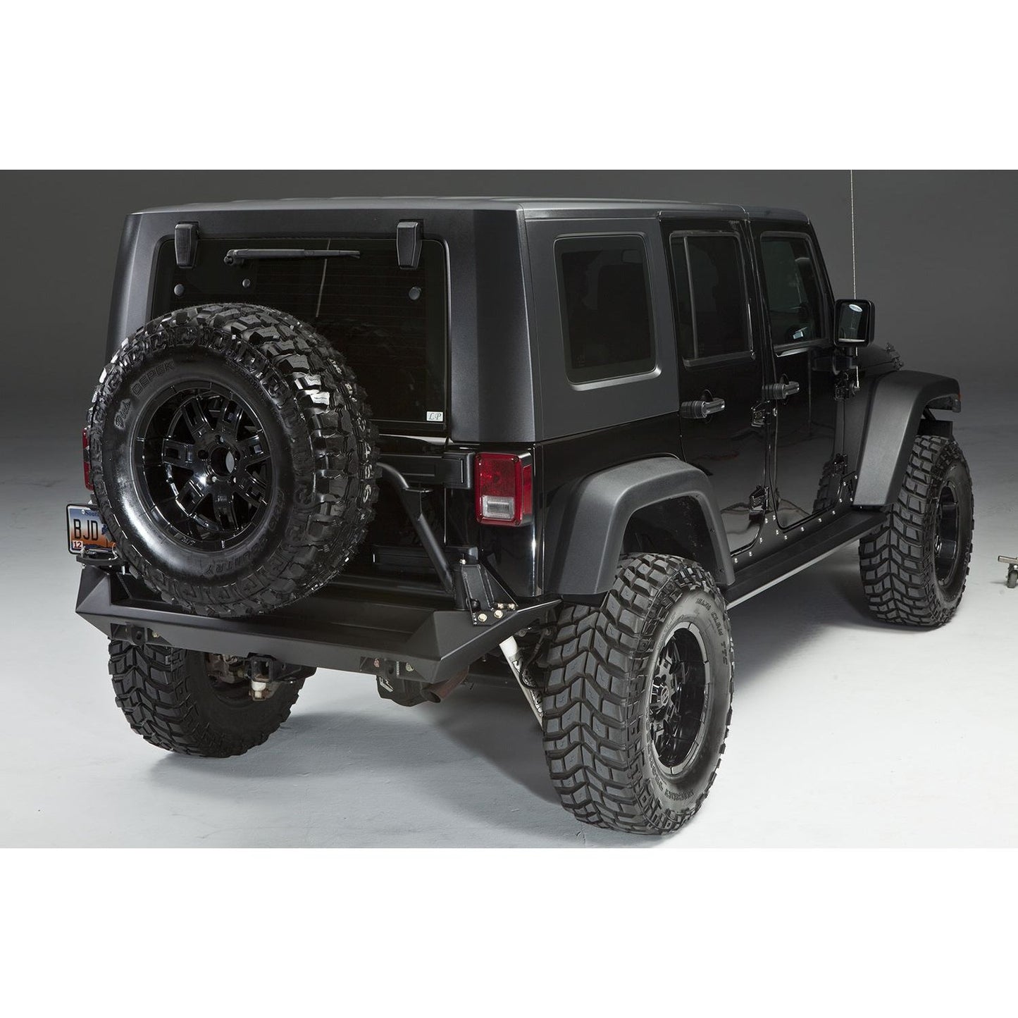 Fab Fours Heavy Duty Rear Bumper 2 Stage Black Powder Coated Incl. CB Mount 0.75 in. D-Ring Mount l JK07-Y1251-1