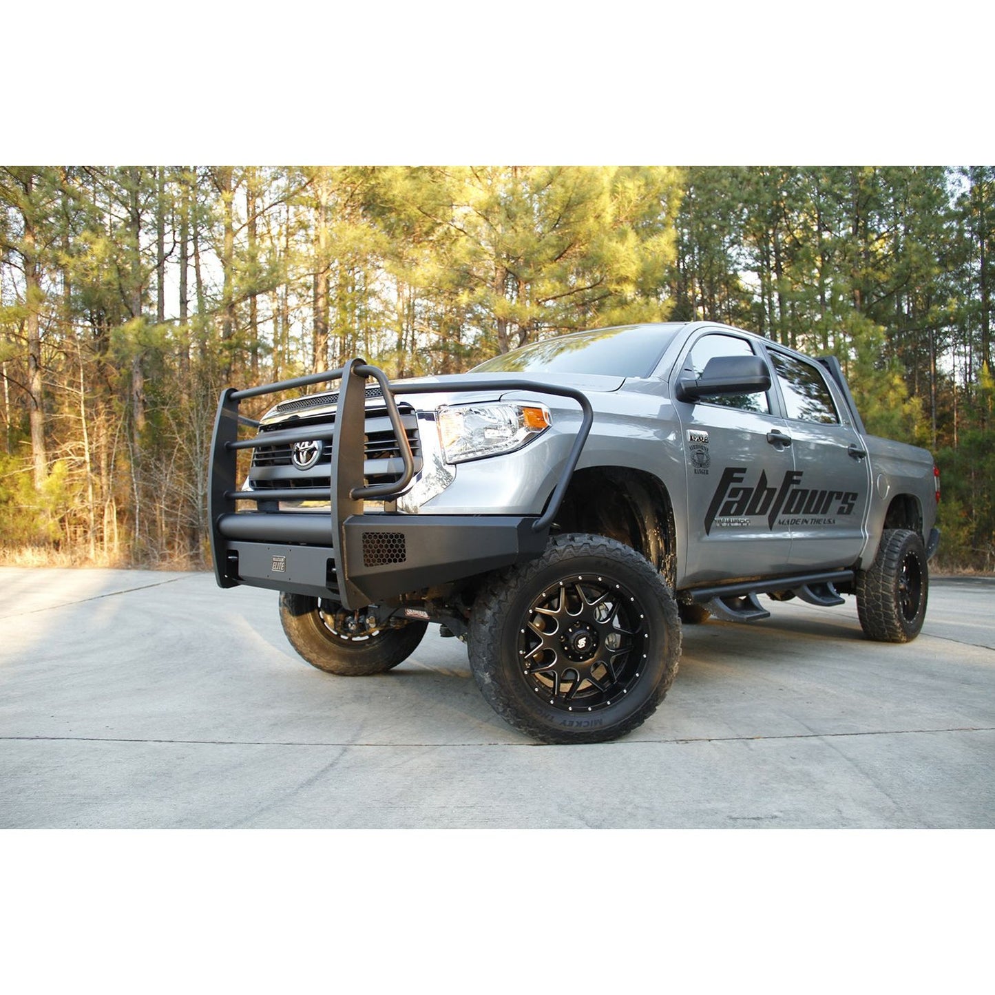 Fab Fours Elite Front Bumper 2 Stage Black Powder Coated w/Full Grill Guard And Tow Hooks l TT14-R2860-1