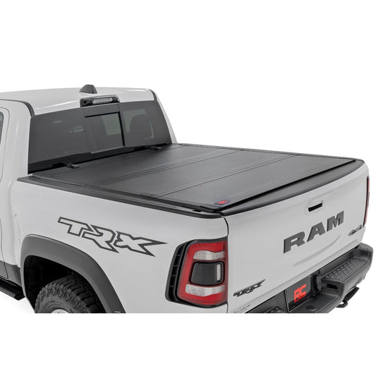 ROUGH COUNTRY Hard Tri-Fold Flip Up Fold Bed Cover | 5'7" Bed | Ram 1500 (19-25)/1500 TRX (21-24)  | 49320550