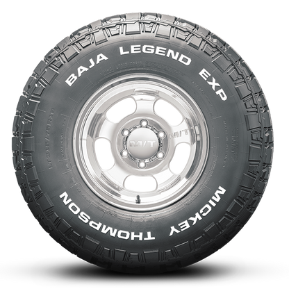 Mickey Thompson Tires BAJA LEGEND EXP with silver rim, showcasing all-terrain performance for trucks and SUVs.